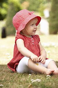 Young Girl Playing In Garden At Home