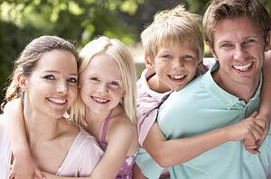 Family Having Fun In Countryside Together