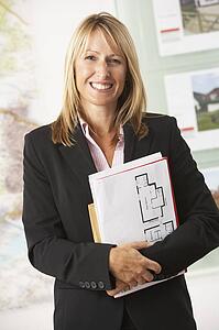 Portrait Of Female Estate Agent In Office