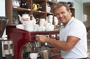 Man Making Coffee In Café