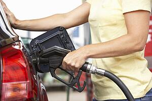 Detail Of Female Motorist Filling Car With Diesel At Petrol Station