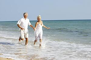 Senior Couple Enjoying Beach Holiday
