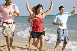 Group Of Friends Enjoying Beach Holiday