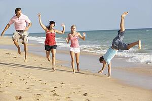 Group Of Friends Enjoying Beach Holiday