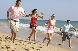 Group Of Friends Enjoying Beach Holiday