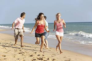 Group Of Friends Enjoying Beach Holiday
