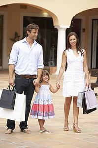 Young Family Enjoying Shopping Trip Together