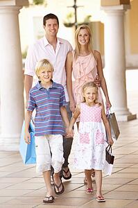 Young Family Enjoying Shopping Trip Together
