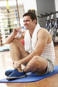 Man Resting After Exercises In Gym