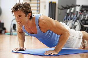 Man Doing Press Ups In Gym