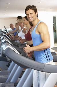 Man On Running Machine In Gym