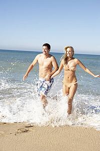 Young Couple Enjoying Beach Holiday