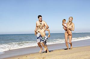 Portrait Of Family On Summer Beach Holiday