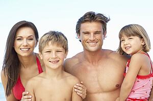 Portrait Of Family On Summer Beach Holiday
