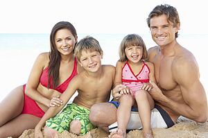 Portrait Of Family On Summer Beach Holiday