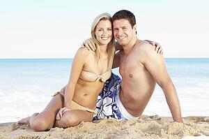Young Couple Enjoying Beach Holiday