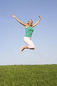 Senior woman jumping in air