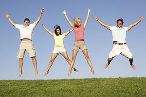 Young couples jumping in air