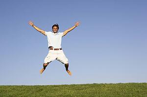 Young man jumping in air