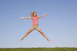 Young woman jumping in air