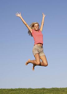 Young woman jumping in air