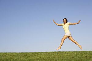Young woman jumping in air