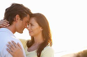 Romantic Young couple in love at sunset