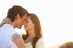 Romantic Young couple in love at sunset