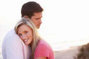 Romantic Young couple in love at sunset