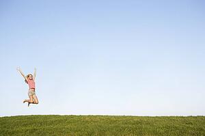 Young woman jumping in air