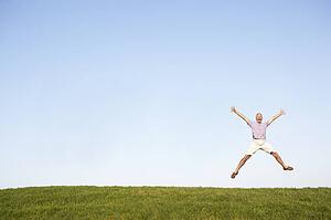 Senior man jumping in air