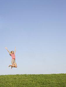 Young woman jumping in air