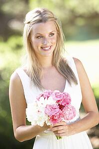 Bride Wearing Dress Holding Bouqet At Wedding