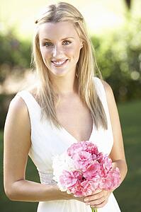 Bride Wearing Dress Holding Bouqet At Wedding