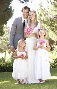 Bride And Groom With Bridesmaid At Wedding