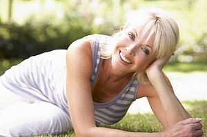 Middle age woman posing in park