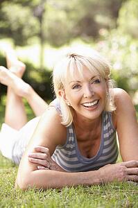 Middle age woman posing in park