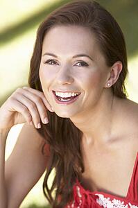 Portrait Of Young Woman Relaxing In Park
