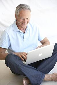 Senior man using laptop computer