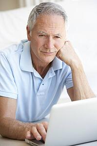 Senior man using laptop computer