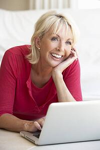 Middle age woman on her laptop computer