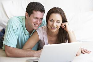 Young couple on laptop computer
