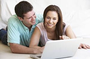 Young couple on laptop computer