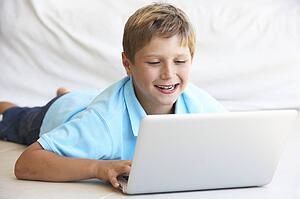 Young boy on his laptop computer