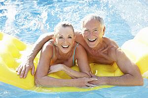 Senior couple having fun in pool