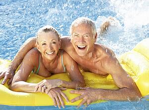 Senior couple having fun in pool
