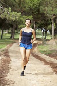 Young woman running in park