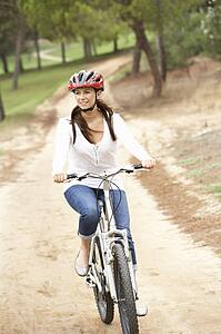 Woman riding bicycle in park