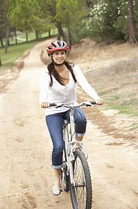 Woman riding bicycle in park