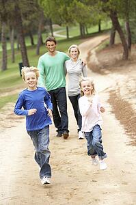 Family enjoying walk in park